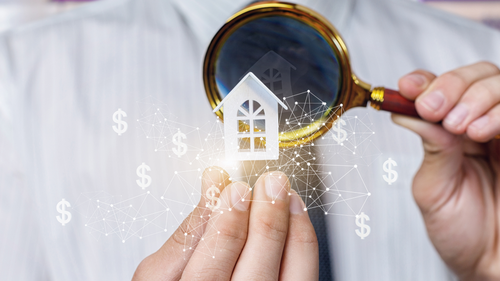 a man in a white dress shirt holding a magnifying glass looking at a white house model he's holding in his hand