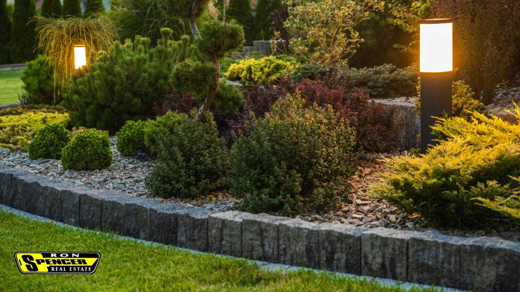 Summer Curb Appeal Tips Evening time landscape lighting in a selection of green bushes
