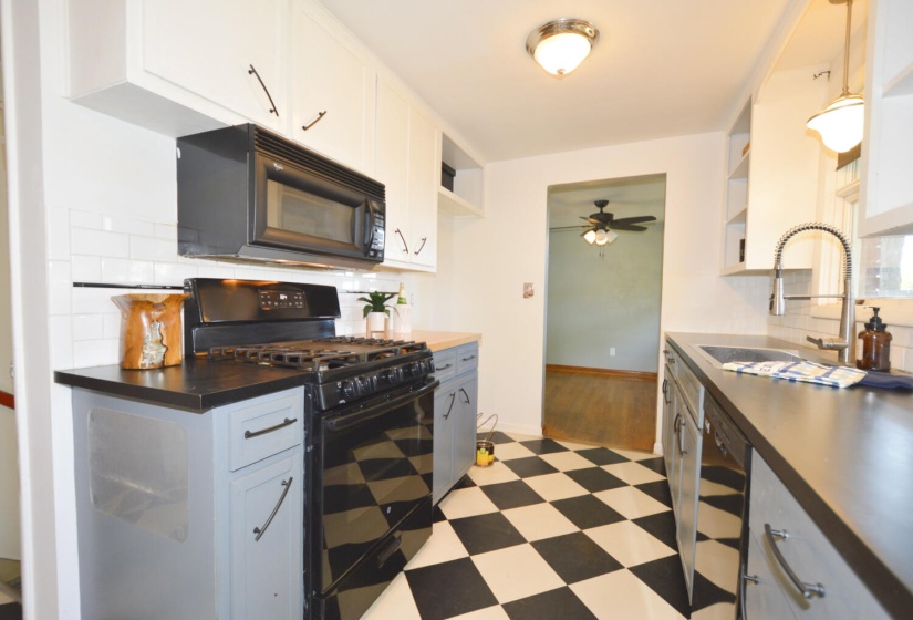 kitchen with gas stove and microwave sta