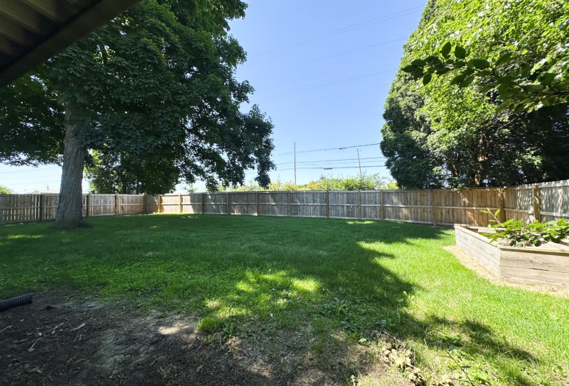 rear fenced yard with new fence