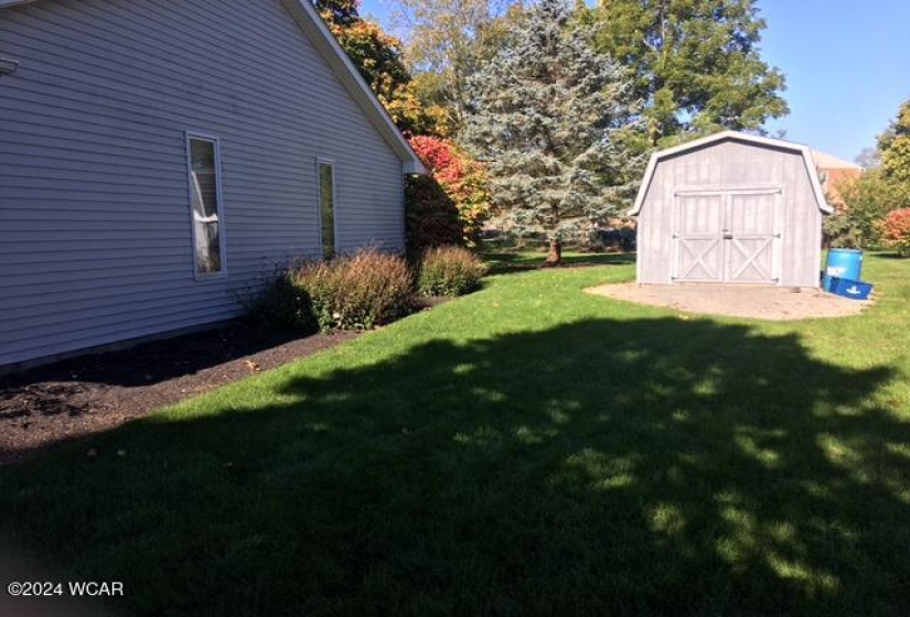 View of side of house and shed