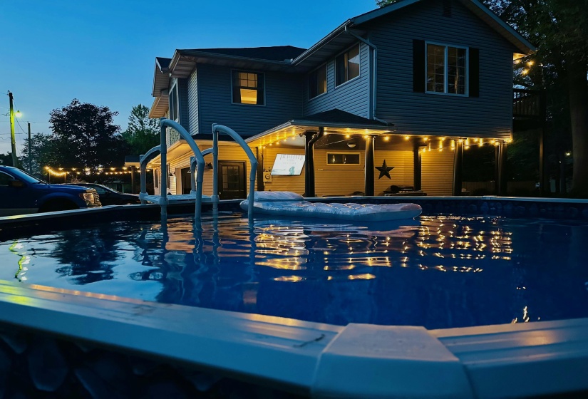 Night photo with above ground pool