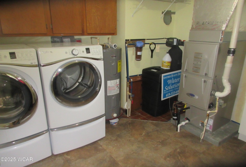 utility room. Includes washer dryer