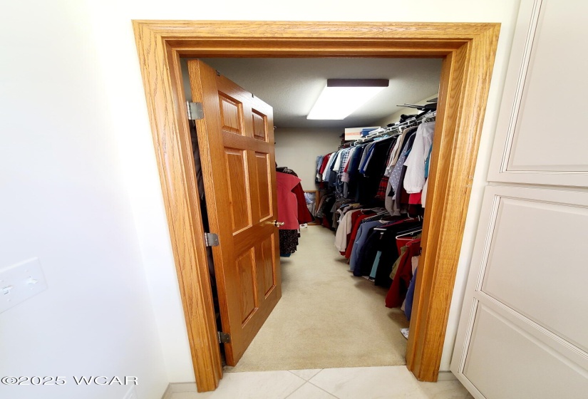 Primary bedroom walk-in closet