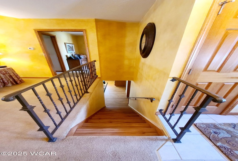 Towards the basement.