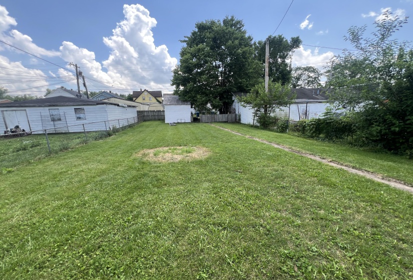 Back Yard Leading To Garage