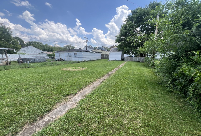 Back Yard Leading To Garage