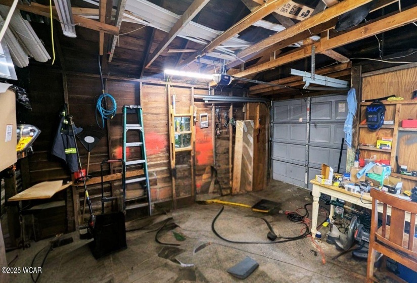 The detached garage is perfect for your vehicle with additional space for storage or a workshop!