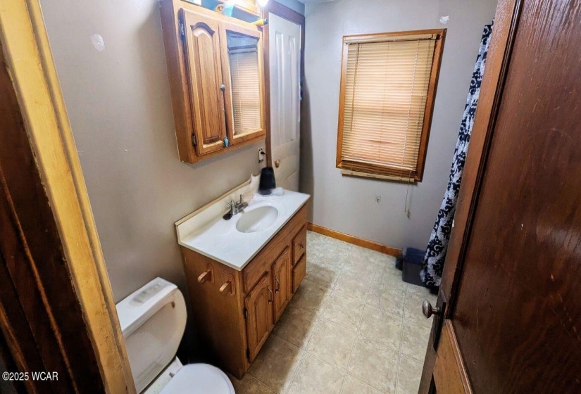 Full Bathroom with vanity and tub/shower combination.