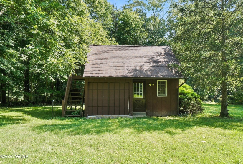 garage/work shed, attic up top in the back of the property
