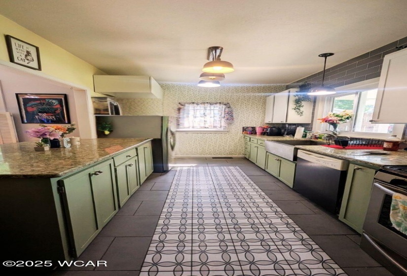 Remodeled galley kitchen with farmhouse sink.