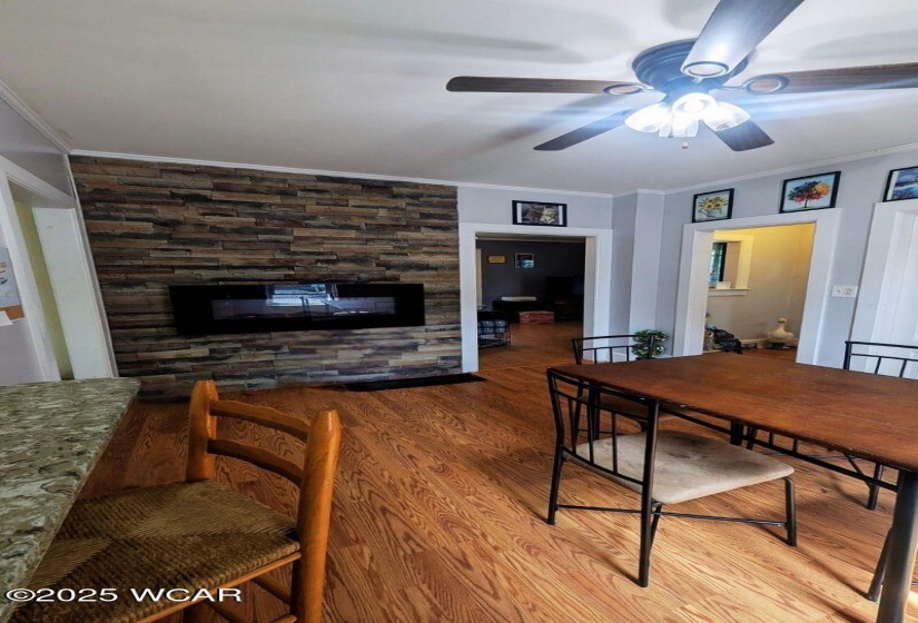 Dining room with electric fireplace.